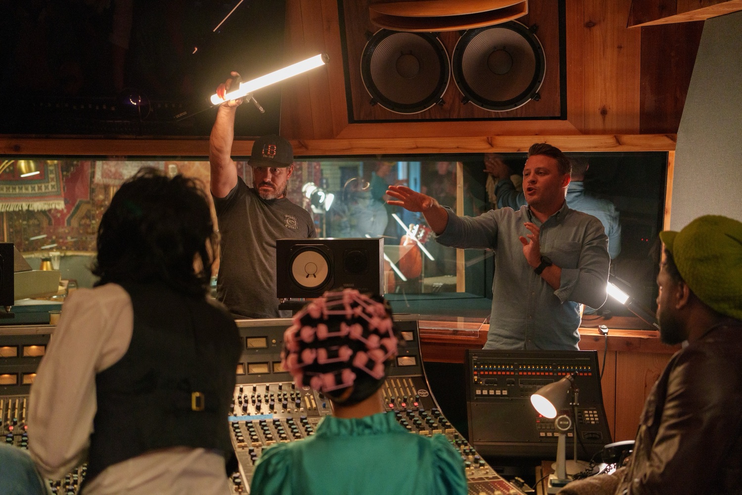 Jonathan Coussens directing a scene in a recording studio.