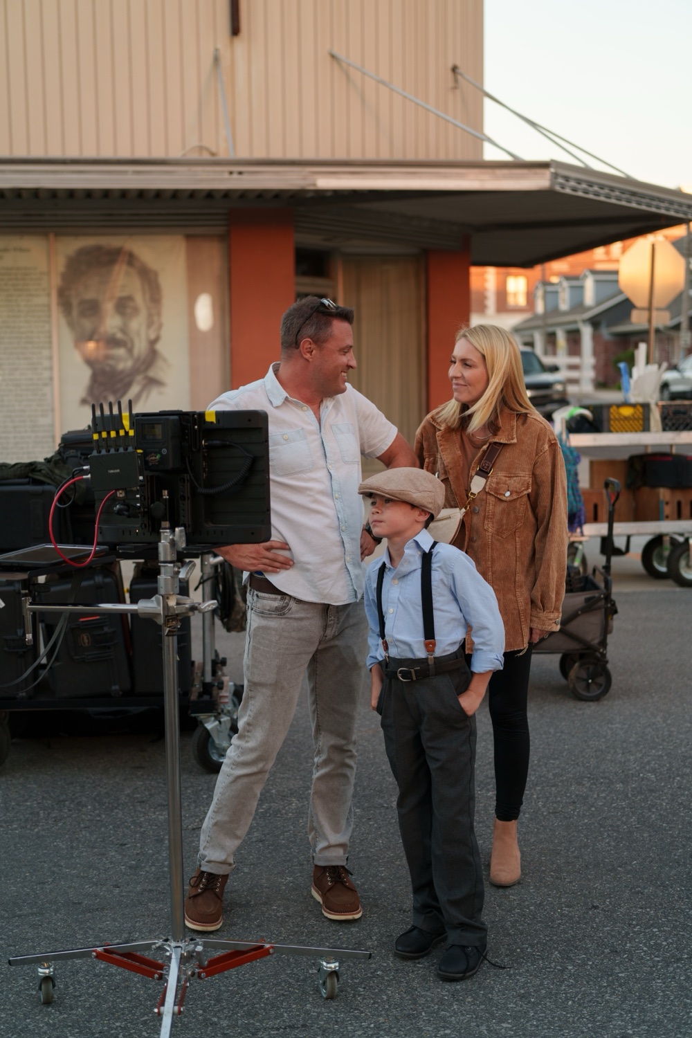 A period street exterior with the camera crew at work.